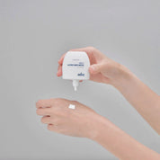 Glutanex Glow Sun Cream Light bottle – brightening and cooling Korean facial sunscreen SPF 50+ PA++++ with 50,000 ppm liposomal glutathione to brighten dark spots, provide a natural glow, and offer comprehensive UV protection, shown with a small swatch of its lightweight, non-greasy texture on the hand.