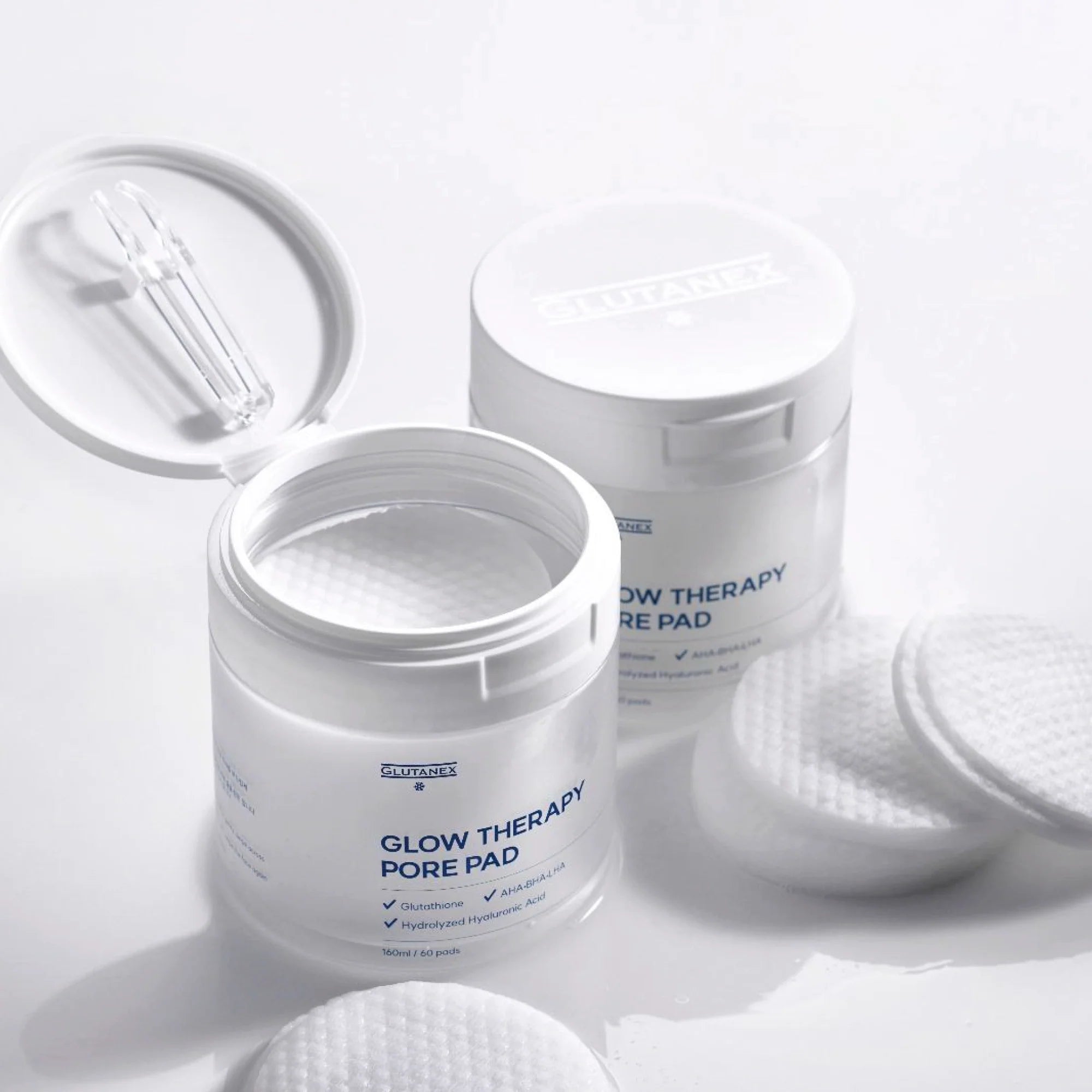 Glutanex Glow Therapy Pore Pad jar with pads and tweezers – brightening and moisturizing Korean toner pads with glutathione and triple hyaluronic acid for hydration. Formulated with AHA, BHA, and LHA to gently exfoliate dead skin and impurities, improving skin texture without irritation.