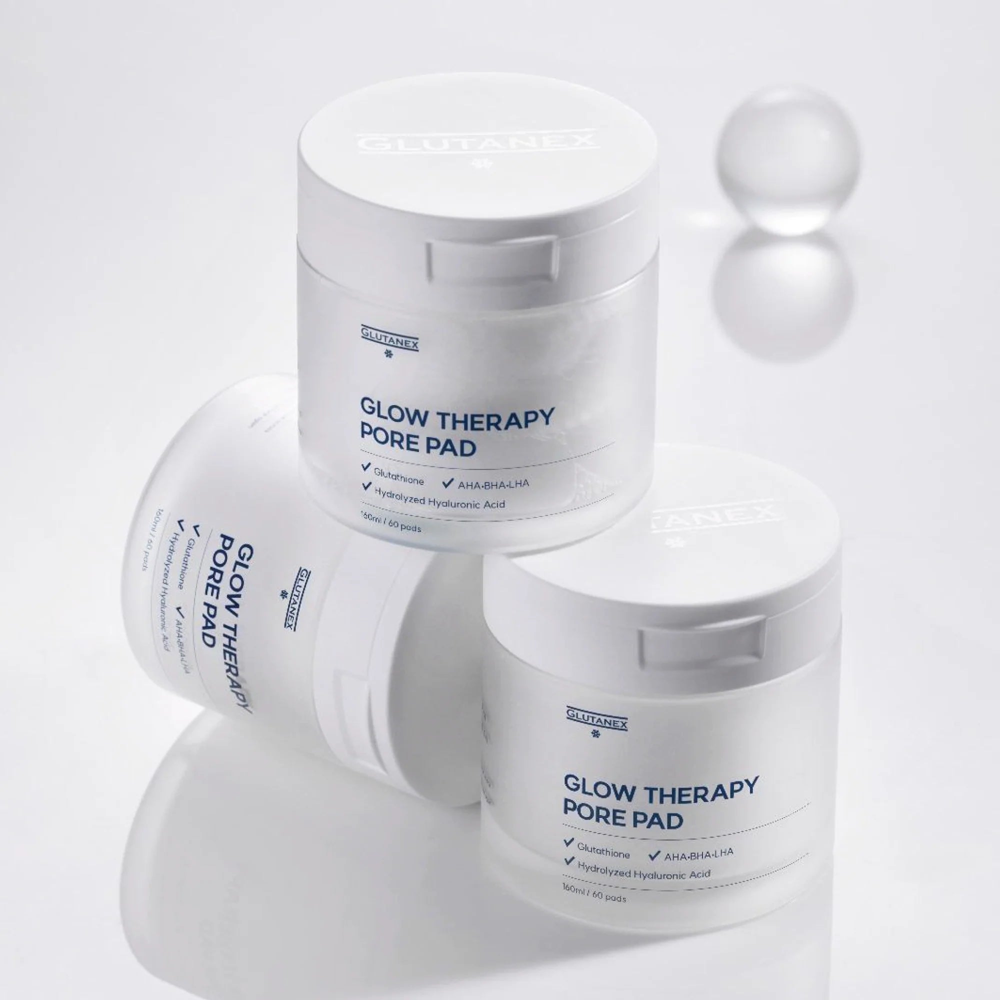 Glutanex Glow Therapy Pore Pad jar with pads and tweezers – brightening and moisturizing Korean toner pads with glutathione and triple hyaluronic acid for hydration. Formulated with AHA, BHA, and LHA to gently exfoliate dead skin and impurities, improving skin texture without irritation.