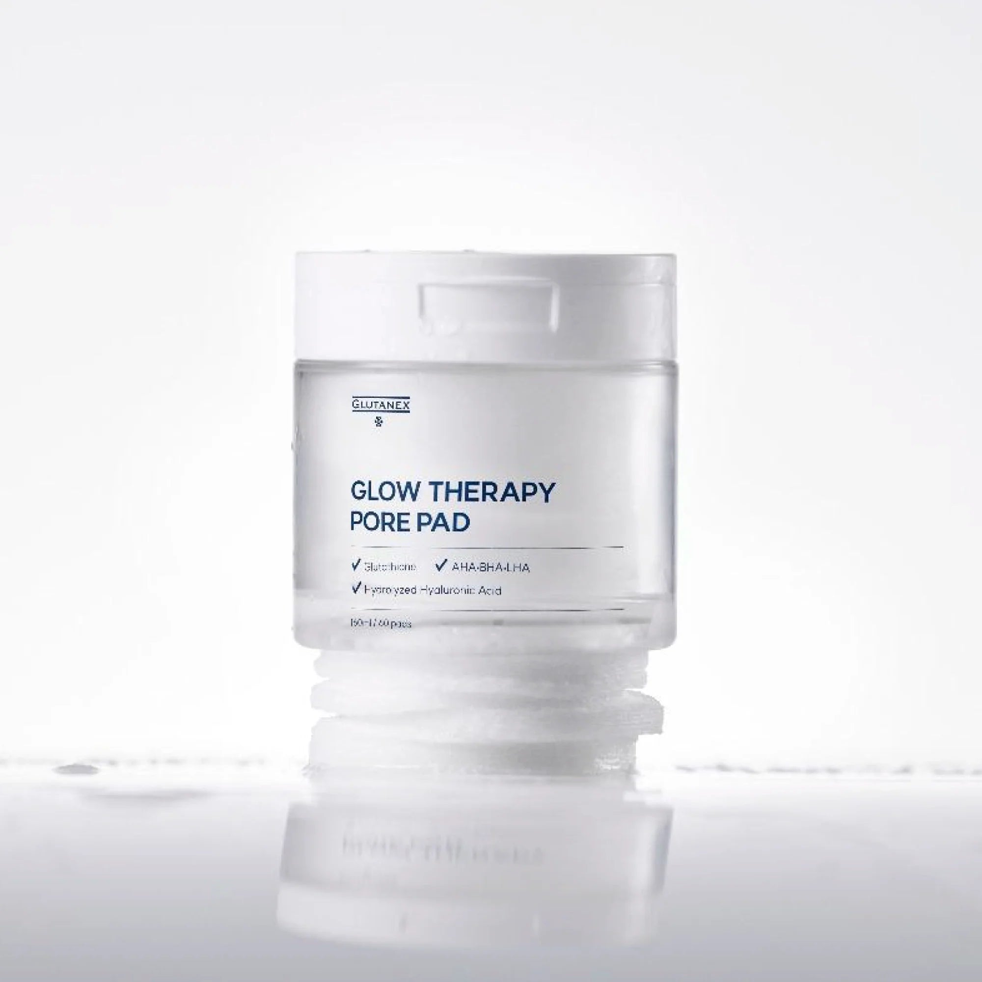 Glutanex Glow Therapy Pore Pad jar with pads and tweezers – brightening and moisturizing Korean toner pads with glutathione and triple hyaluronic acid for hydration. Formulated with AHA, BHA, and LHA to gently exfoliate dead skin and impurities, improving skin texture without irritation.