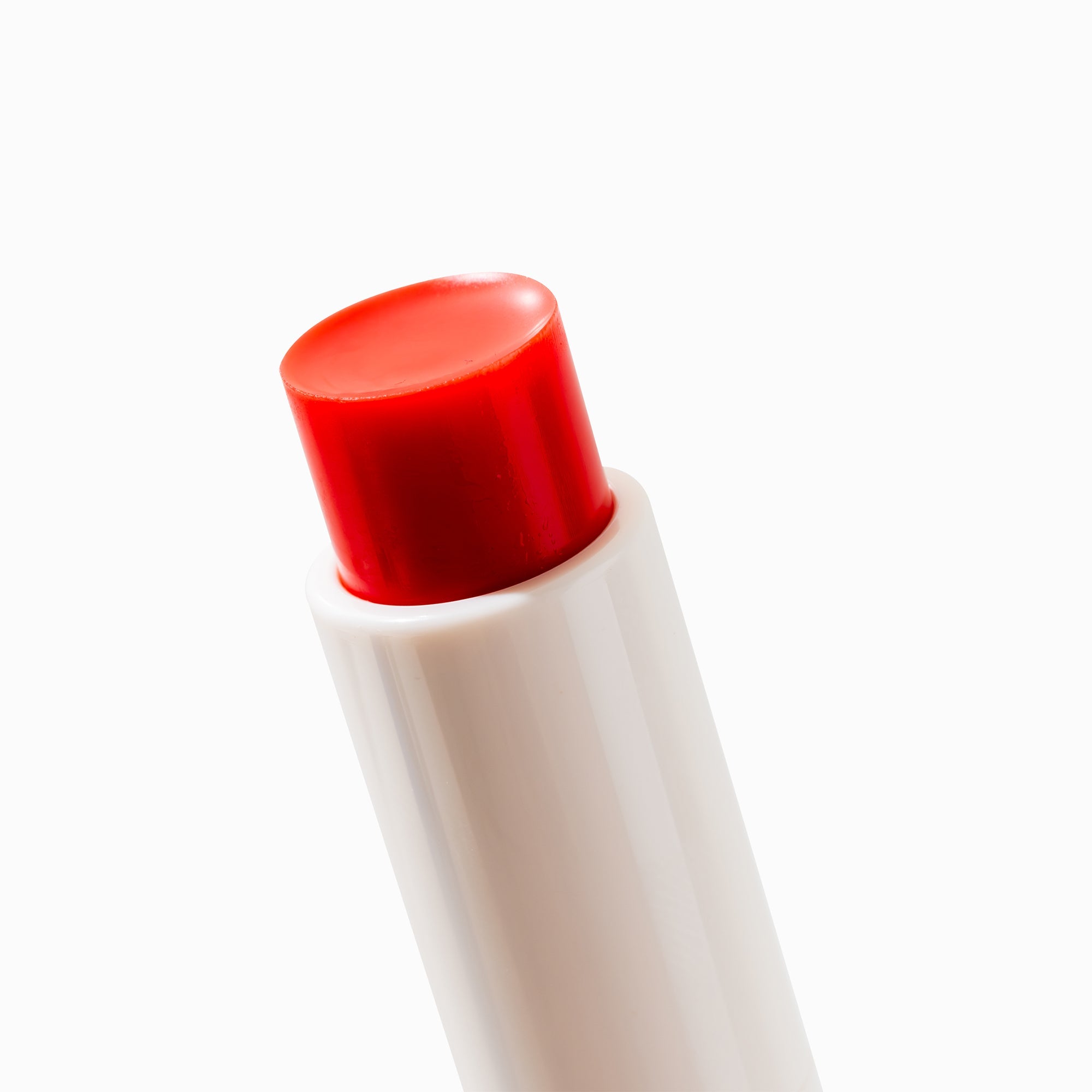 Glutanex Lip Glow Balm stick – a hydrating and nourishing lip balm with shea butter and glutathione. It provides lasting moisture and a soft scarlet glow for all-day comfort.